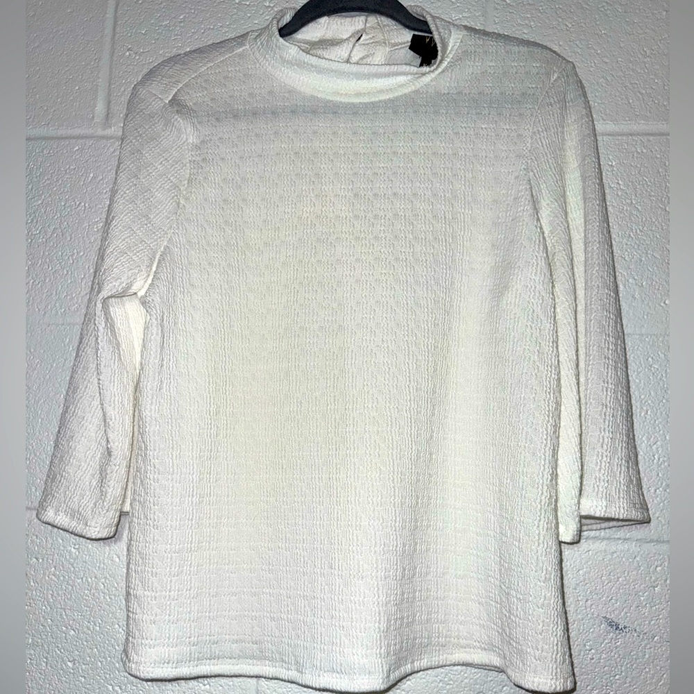 Women’s soft white blouse with buttoned back
